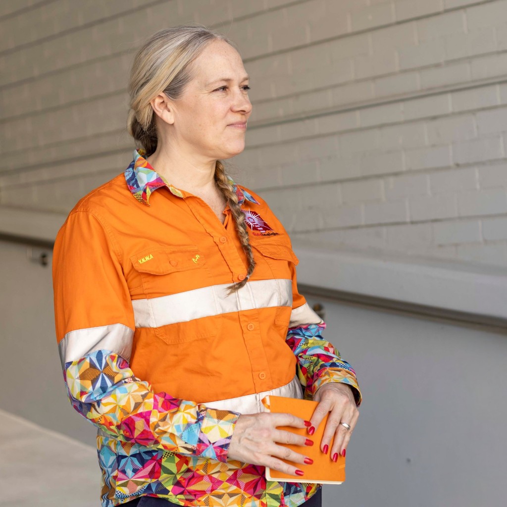 Monica Brown, Director at Red Insight, reviewing digital WHS systems on a construction site